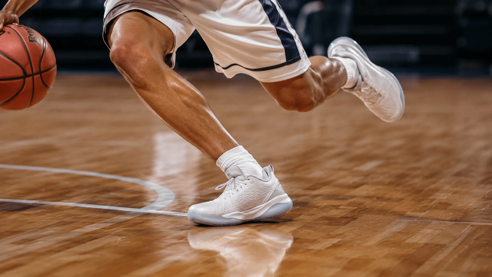 Close-up of a planted foot and flexed knee during a basketball change-of-direction movement